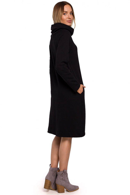 Black Moe asymmetrical cowl neck dress with side pockets and a relaxed fit for casual wear