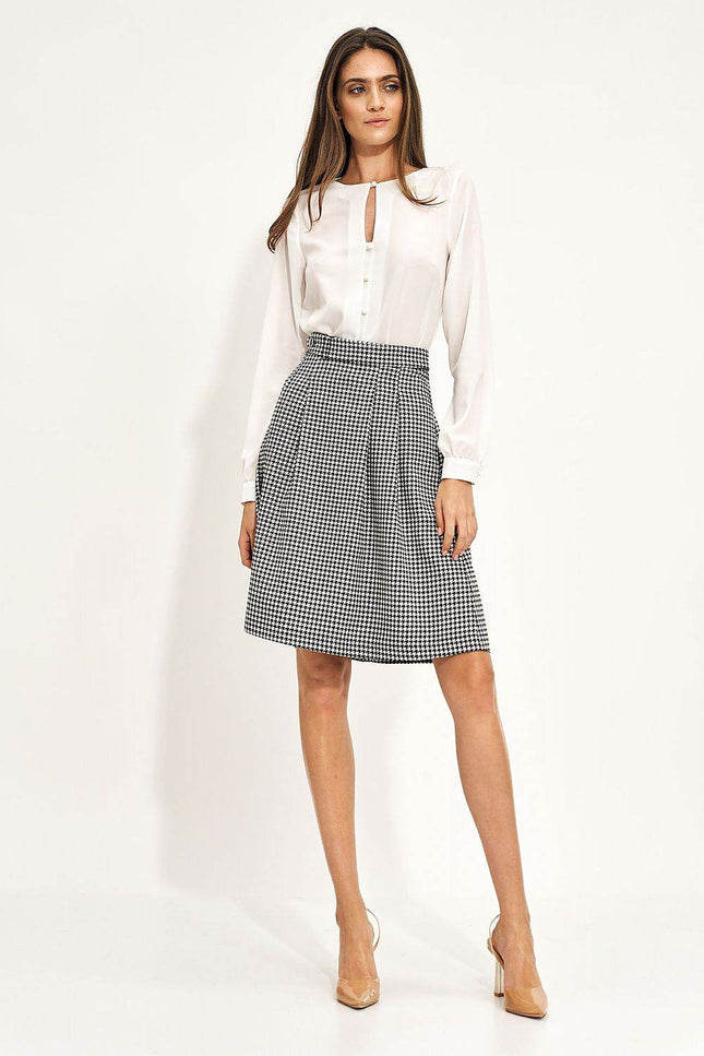 Elegant houndstooth skirt by Nife, featuring a pleated design, perfect for chic casual or formal wear