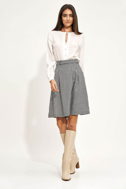 Nife elegant houndstooth skirt styled with a white blouse and knee-high boots