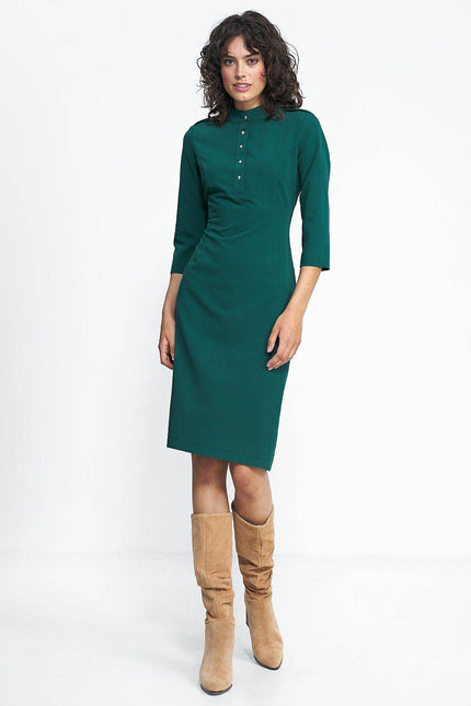 Nife placket dress in dark green with three-quarter sleeves and button details for a chic look