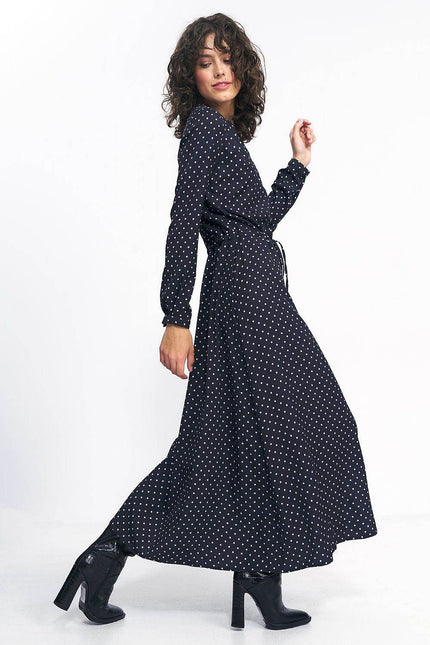 Nife polka dot maxi dress with long sleeves and a flowy silhouette, perfect for stylish occasions