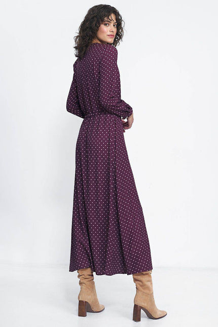 Nife polka dot maxi dress in burgundy with long sleeves and a flowing silhouette