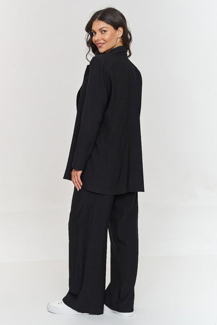 Black tailored set from Makadamia featuring a relaxed blazer and wide-leg pants for a chic look
